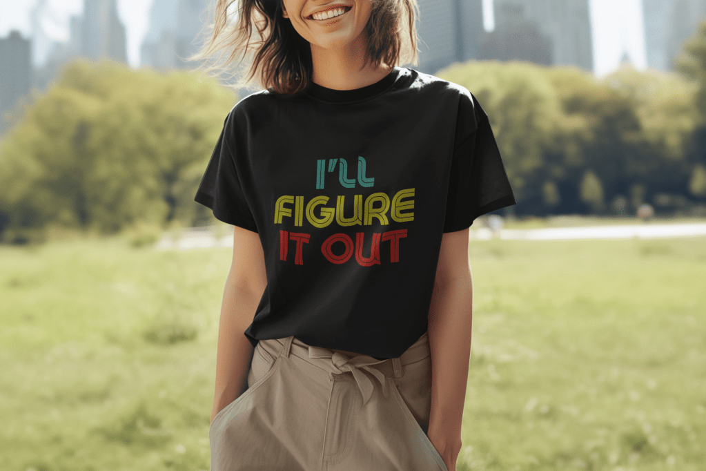 woman wearing an I'll Figure It Out t shirt in a retro font.
