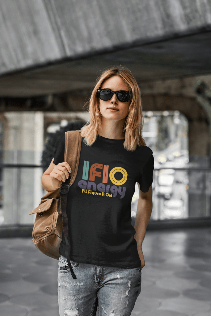 woman walking in ripped jeans carrying a backpack wearing sunglasses wearing and IFIO energy t shirt